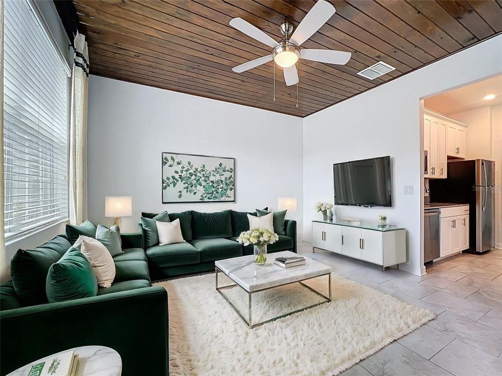 A single-story house with a stone-accented entryway, a two-car garage, and a paved driveway — 195 PRESTON AVE, DAVENPORT, FL