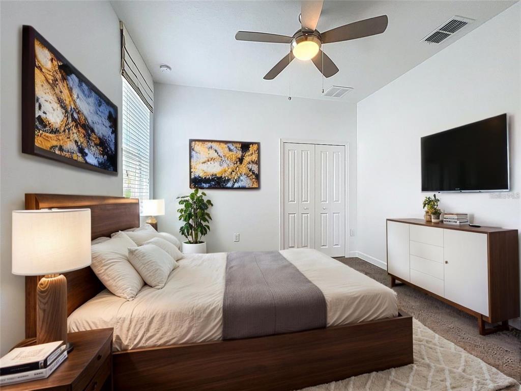 A living room features a green sectional sofa, marble coffee table, and wood-paneled ceiling — 195 PRESTON AVE, DAVENPORT, FL