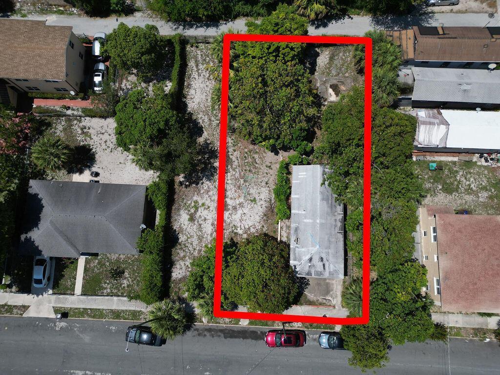 An aerial view shows a rectangular lot with a small structure surrounded by mature trees — 809 7th Street, West Palm Beach FL 33401, WEST PALM BEACH, FL