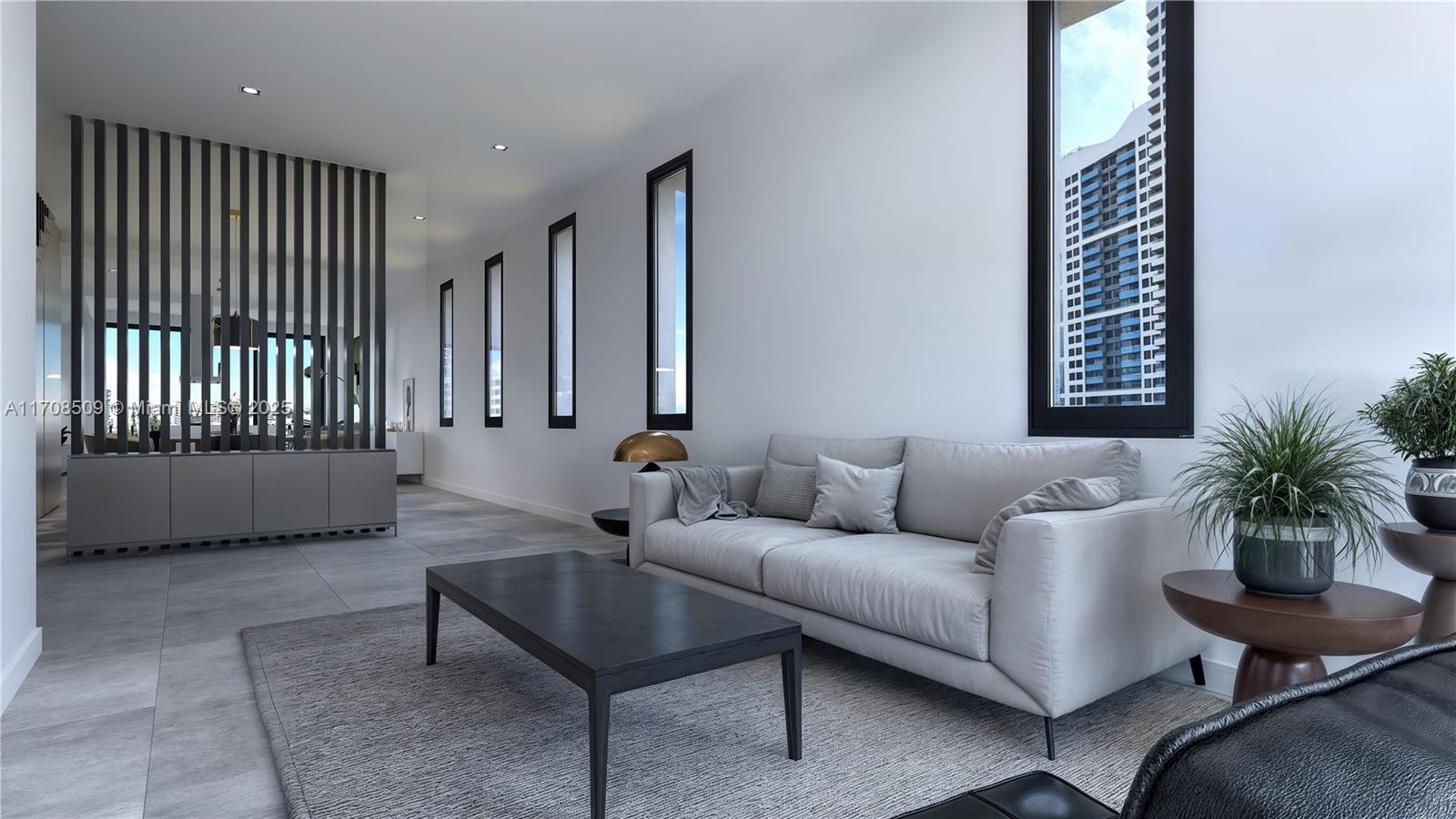 A modern living room features a grey sofa, a black coffee table, and vertical slat partitions — 1331 14th Ter, Miami Beach FL 33139, MIAMI BEACH, FL