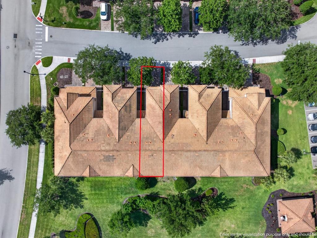 An aerial view shows a multi-unit residential building with a red outline highlighting one section — 8311 FOSTER DRIVE, DAVENPORT, FL