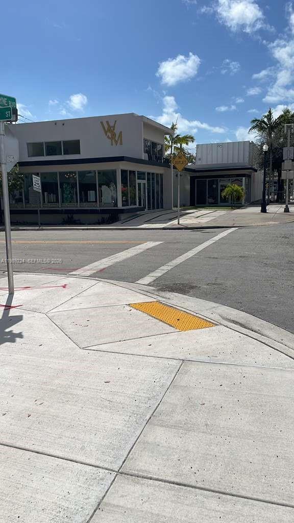 A street-level view shows a two-story commercial building with a "WM" logo on the facade — 7111 Biscayne Blvd, Miami FL 33138, MIAMI, FL