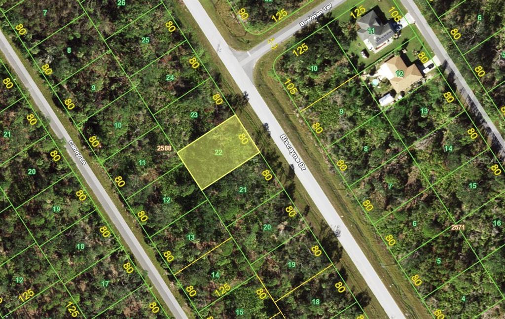 This is a map showing a highlighted rectangular land parcel located between two roads — 1829 BISCAYNE DRIVE, PORT CHARLOTTE, FL