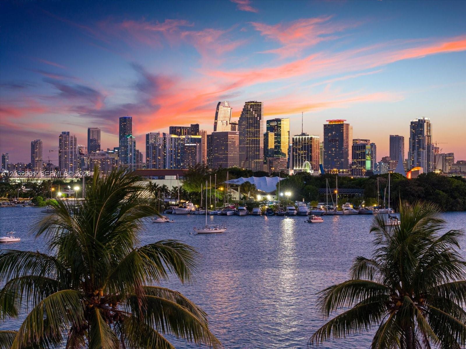 A view of the Miami skyline at sunset across a bay with boats and palm trees — 1228 S Venetian Way, Miami FL 33139, MIAMI, FL