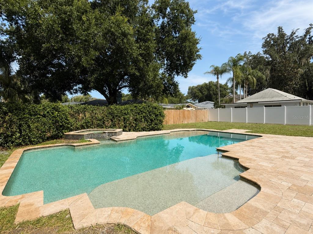 A two-story stucco house with a tile roof, two-car garage, and a paved driveway — 1830 GERDA TERRACE, ORLANDO, FL