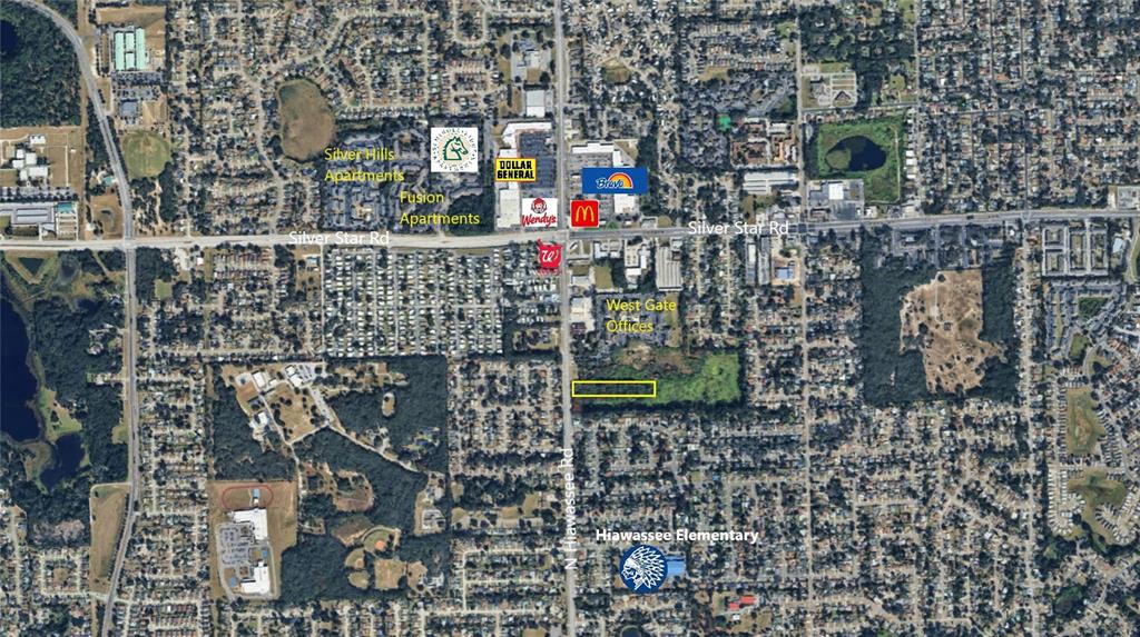This is an aerial map showing a vacant lot highlighted in yellow near Hiawassee Road — N HIAWASSEE ROAD, ORLANDO, FL