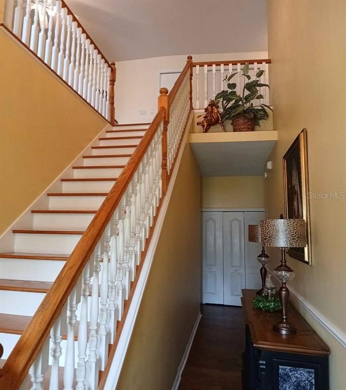 A long, covered outdoor porch with white columns, light flooring, and recessed ceiling lights — 10264 W SPRINGTREE LANE, CRYSTAL RIVER, FL