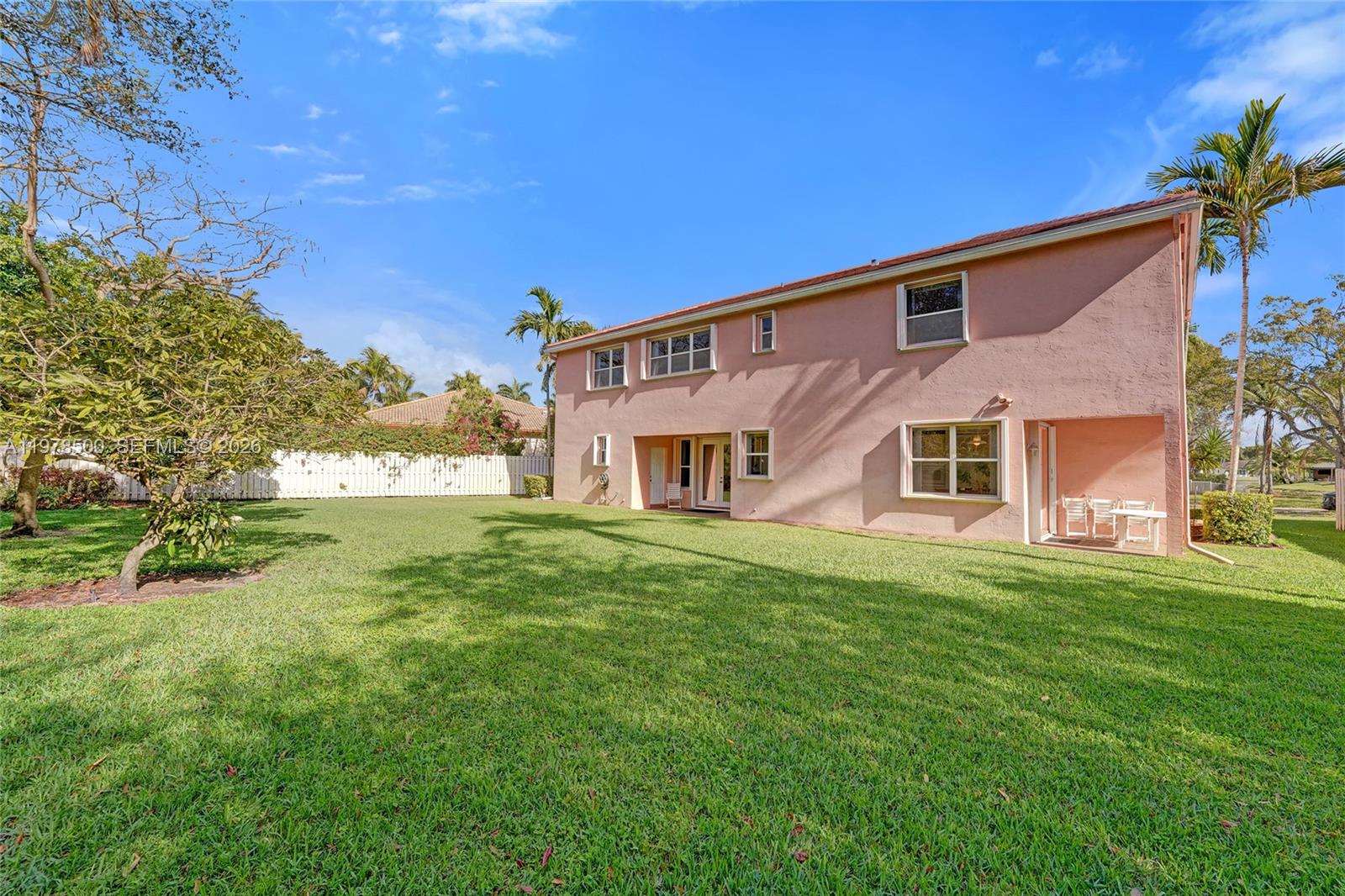 A two-story pink house with a large backyard and a white fence — 14686 SW 35th Ct, Miramar FL 33027, MIRAMAR, FL