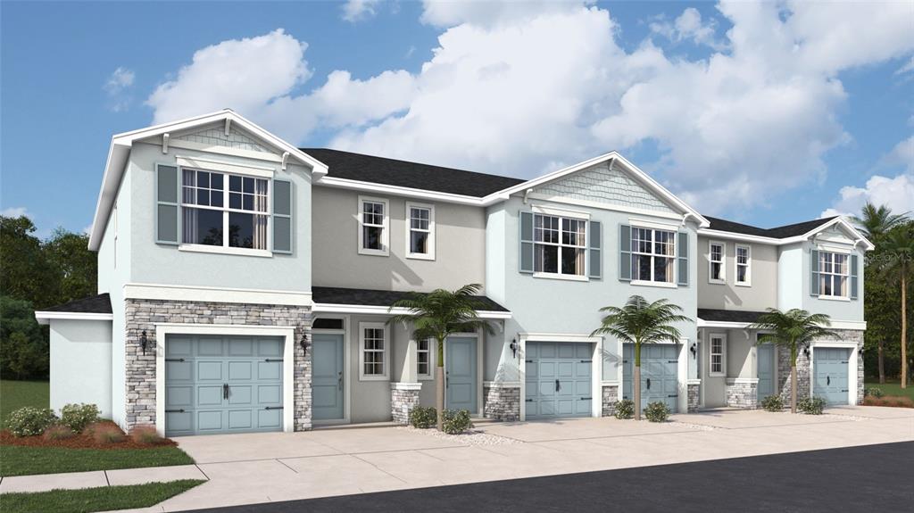 A rendering of a multi-unit townhouse complex with light blue siding, stone accents, and garages — 10698 TIGER LILY DRIVE, VENICE, FL