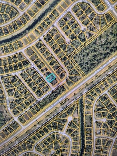 This is an aerial map showing a highlighted vacant residential lot in a suburban neighborhood — NOCTURN STREET, NORTH PORT, FL