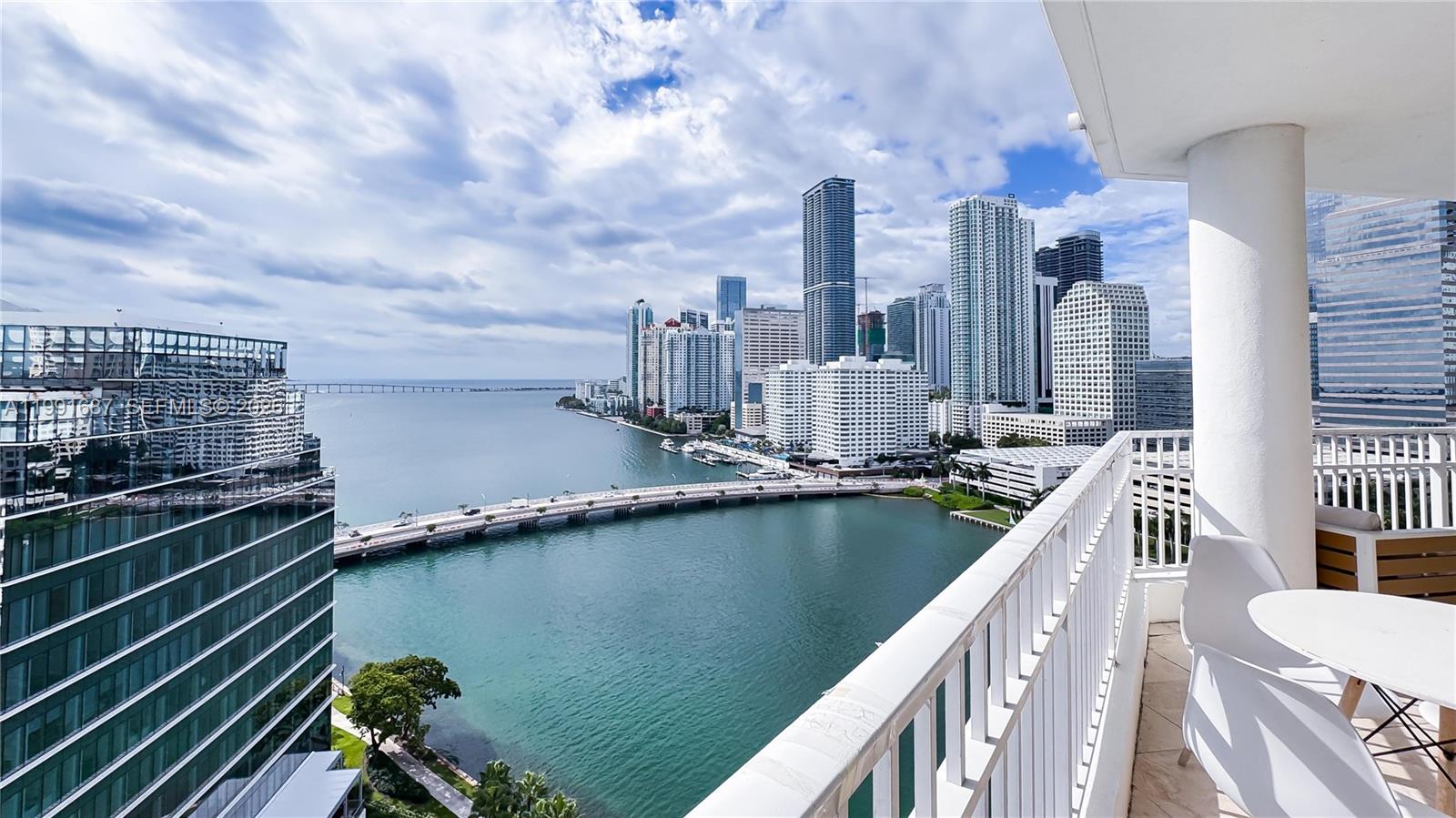 A balcony overlooks a bay with a bridge and a dense city skyline — 701 Brickell Key Blvd # 1912, Miami FL 33131, MIAMI, FL