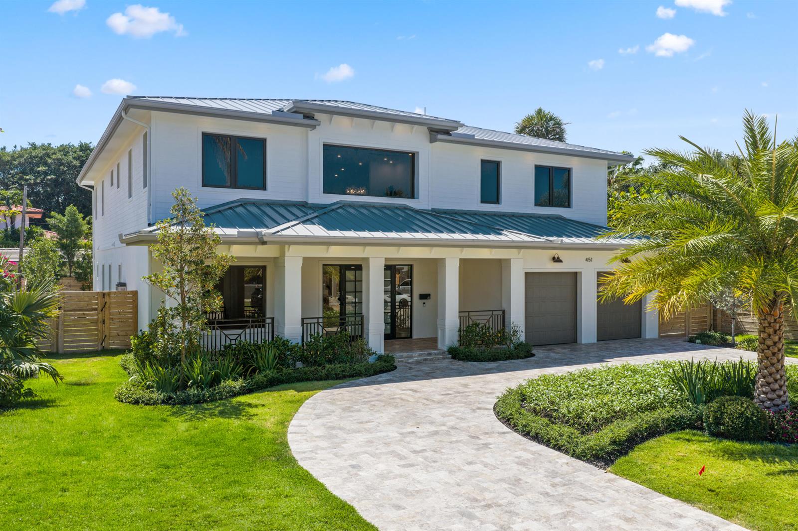 A modern kitchen features a large dark marble island with six beige bar stools — 451 NW 7th Avenue, Boca Raton FL 33486, BOCA RATON, FL
