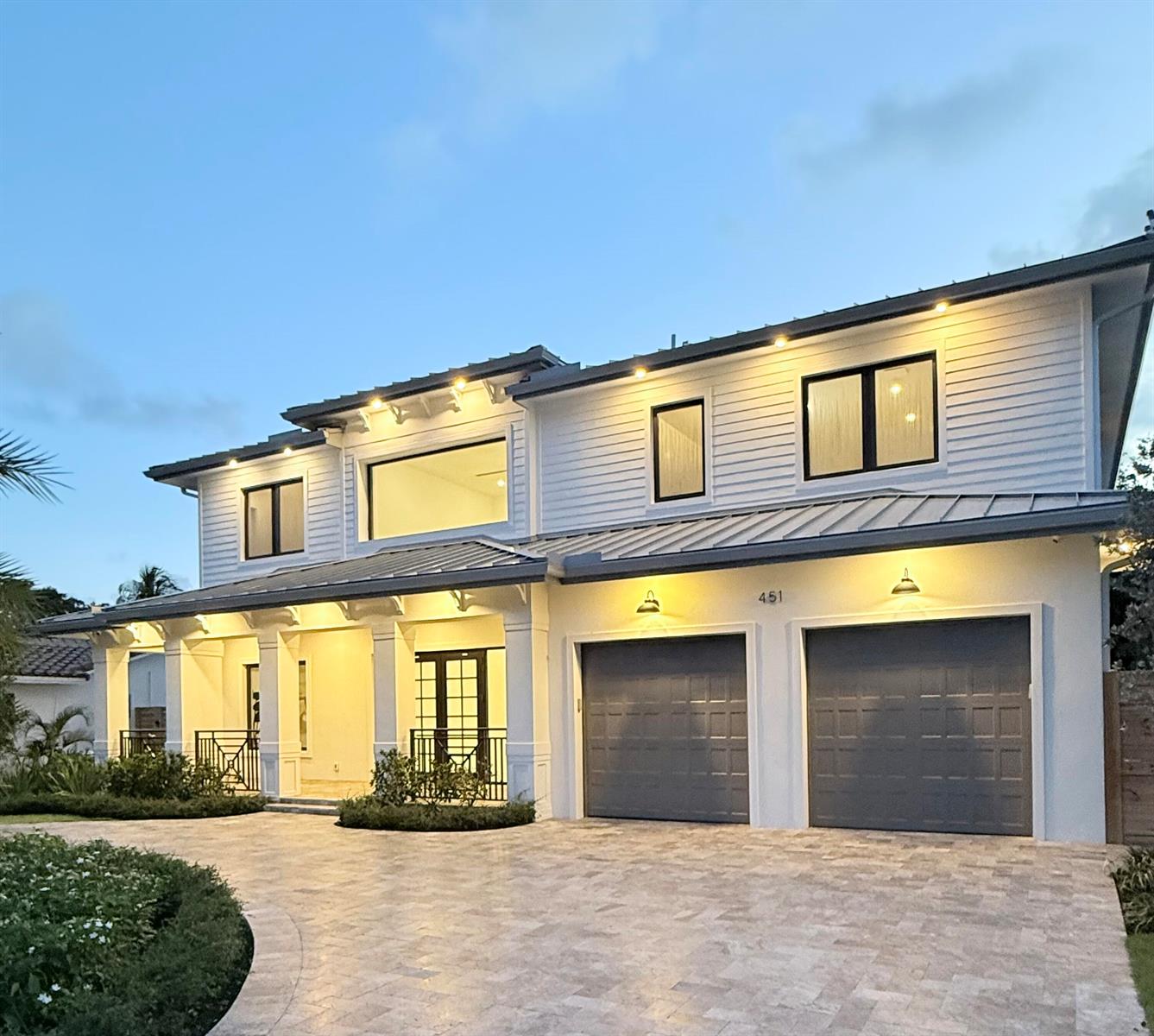A bright, open-concept living room and kitchen area features white tile floors and a pool — 451 NW 7th Avenue, Boca Raton FL 33486, BOCA RATON, FL