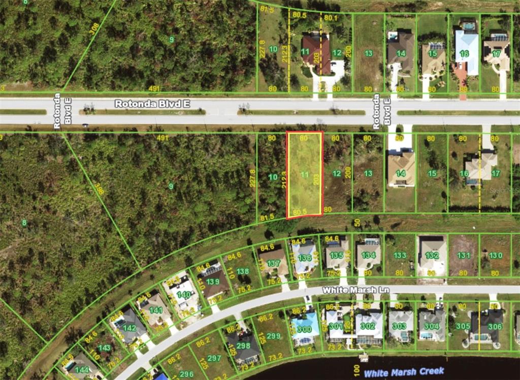 This is an aerial map showing a vacant lot highlighted in red among residential properties — 168 ROTONDA BOULEVARD E, ROTONDA WEST, FL