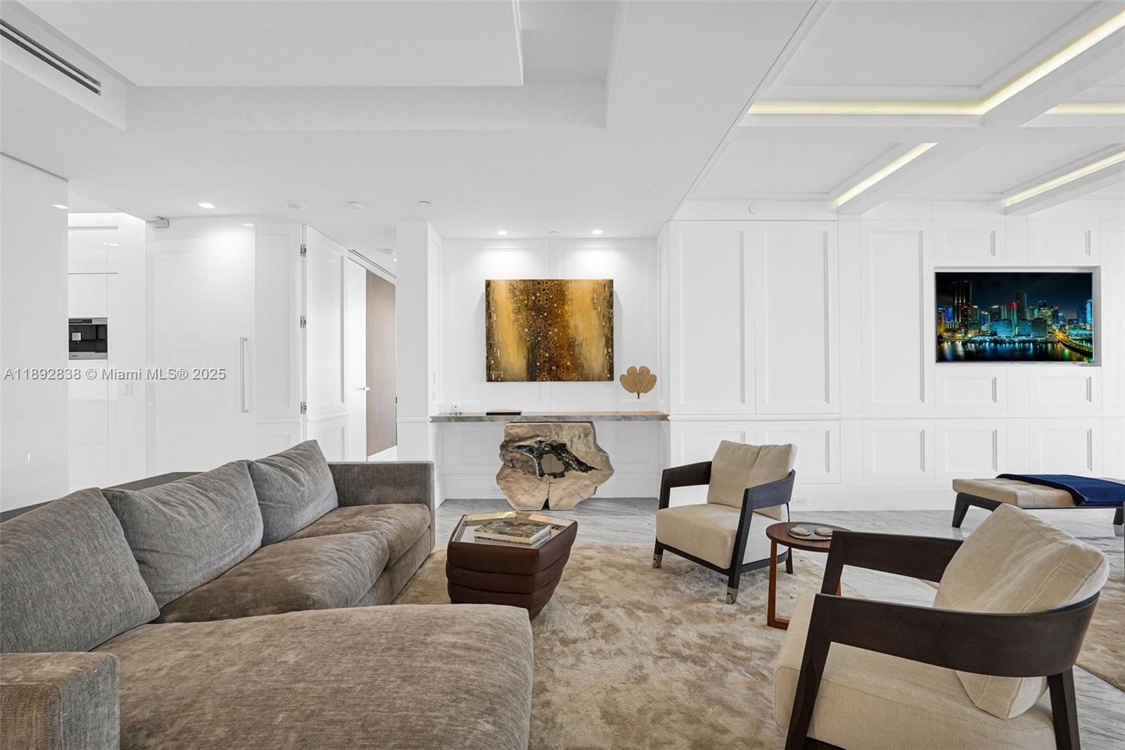 A modern living room features a gray sectional sofa, two armchairs, and a wood console — 9701 Collins Ave # 2104S, Bal Harbour FL 33154, BAL HARBOUR, FL