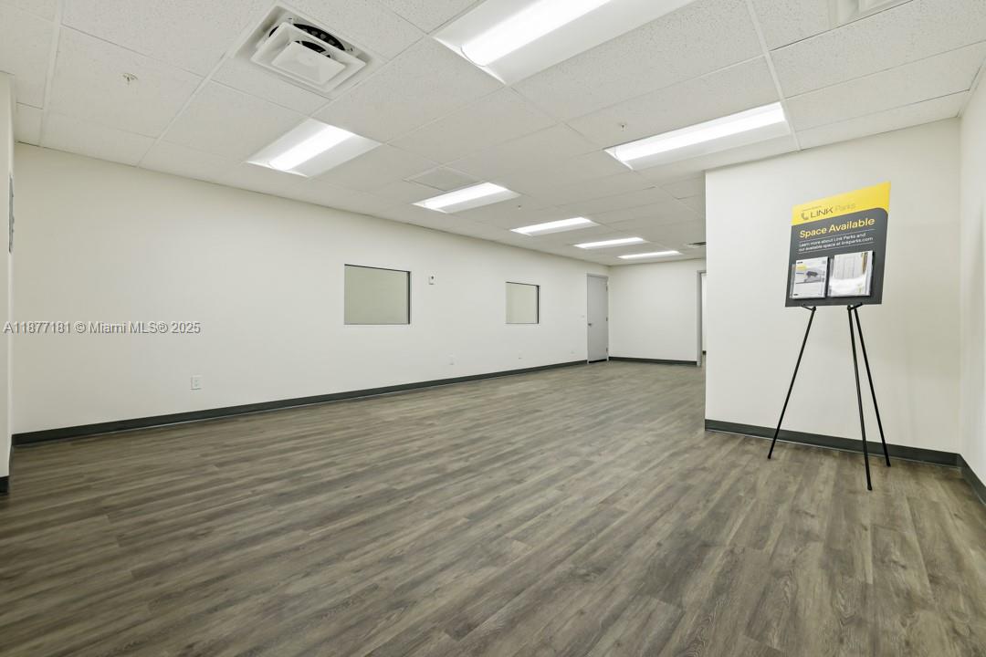 An empty office space with white walls, recessed lighting, and wood-look vinyl flooring — 2273 NW 82nd Ave # 2293, Doral FL 33122, DORAL, FL