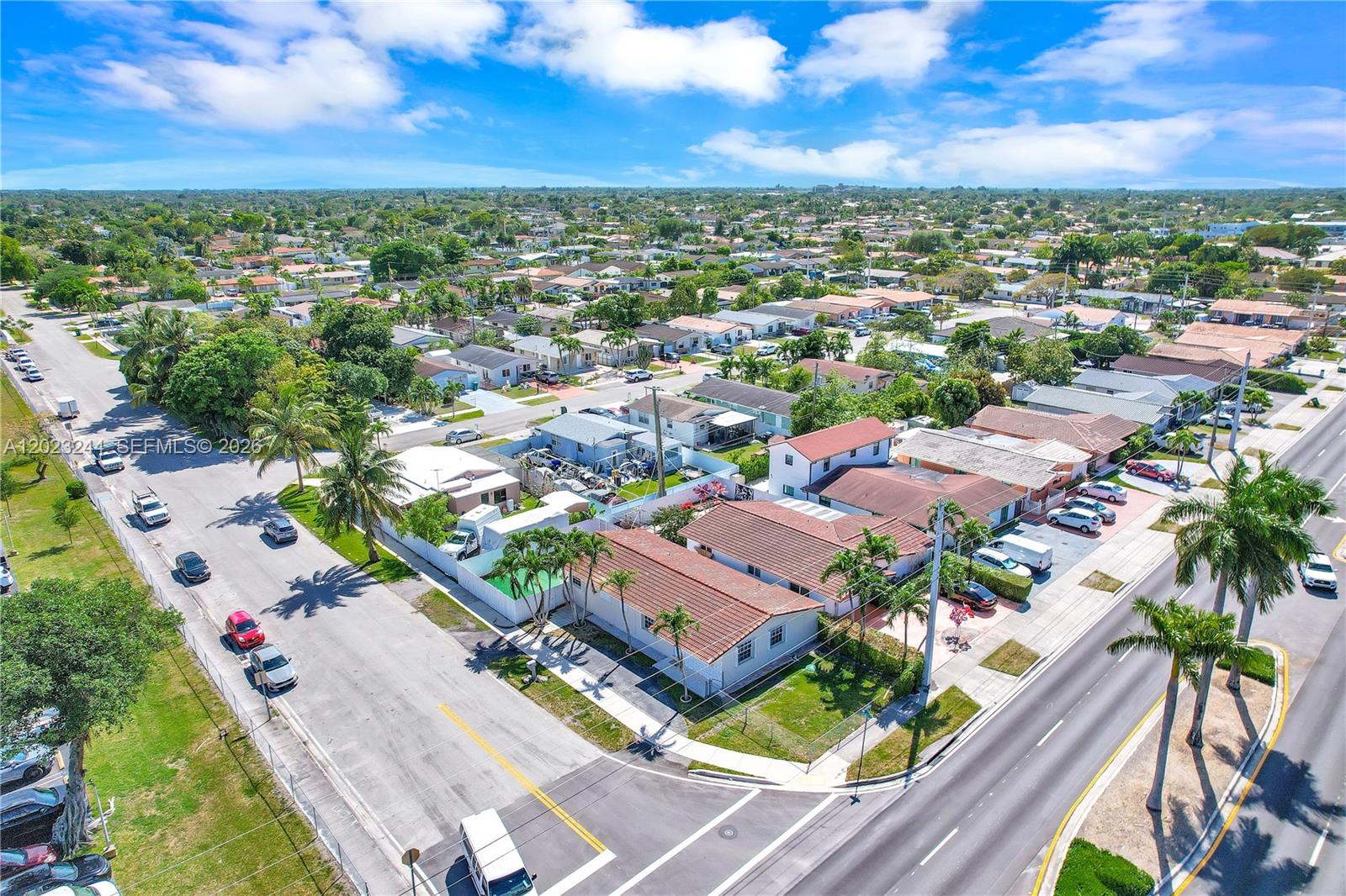 An aerial view shows a residential neighborhood with houses, streets, and parked cars — 2400 SW 103rd Ct, Miami FL 33165, MIAMI, FL