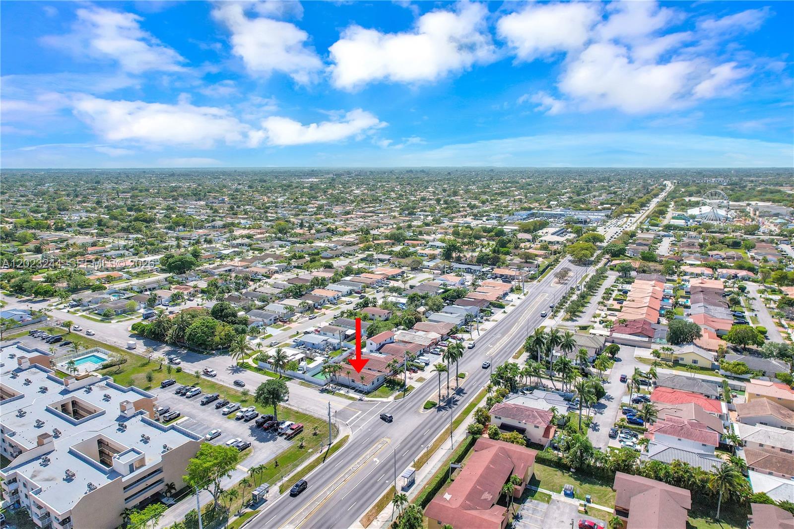 An aerial view shows a residential property marked with a red arrow near a road — 2400 SW 103rd Ct, Miami FL 33165, MIAMI, FL