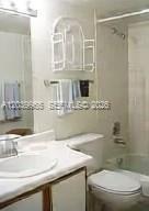 A bathroom features a white vanity with a sink, a toilet, and a shower-tub combination — 3930 S Roosevelt Blvd # 0, Key West FL 33040, KEY WEST, FL