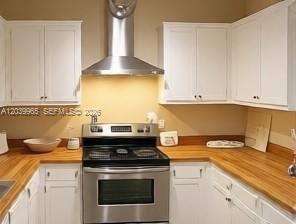 A kitchen features white cabinets, a stainless steel range, and wood countertops — 3930 S Roosevelt Blvd # 0, Key West FL 33040, KEY WEST, FL