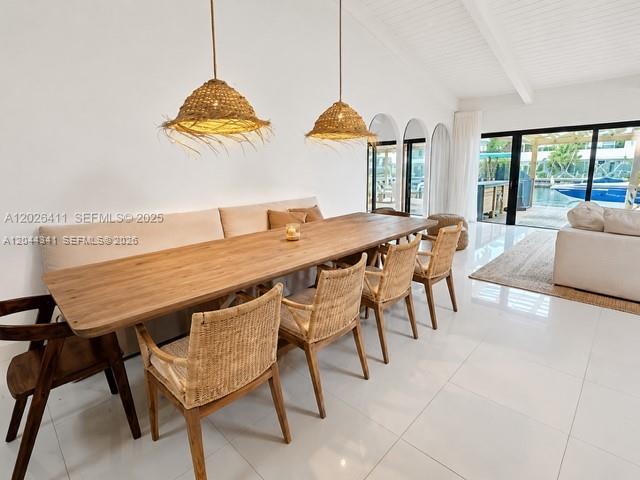 A bright, open-concept living and dining area features a large white sectional and skylights — 2641 S Parkview Dr, Hallandale Beach FL 33009, HALLANDALE BEACH, FL