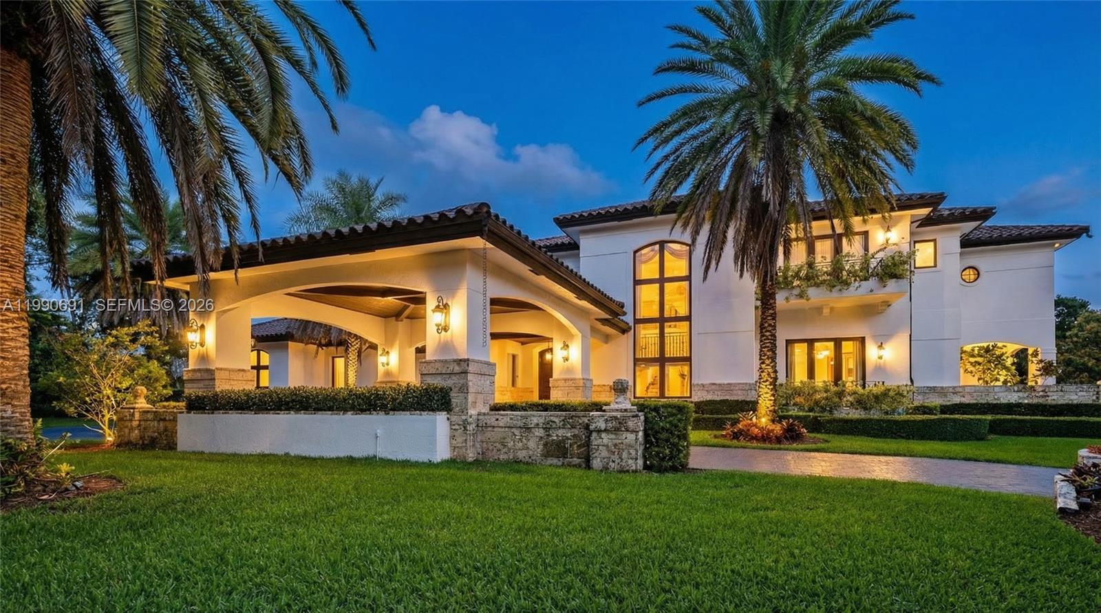 A two-story white stucco house features a large porte-cochère and a prominent palm tree — 7701 Old Cutler Rd, Coral Gables FL 33143, CORAL GABLES, FL