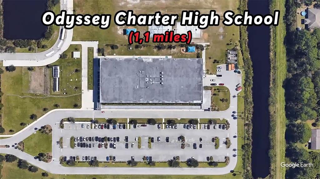 This aerial map view shows the Odyssey Charter High School building, parking lot, and grounds — 1059 LAVA STREET SE, PALM BAY, FL