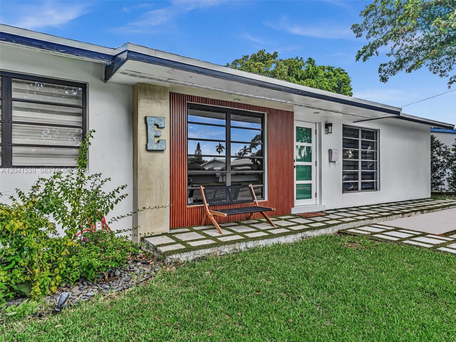A backyard features a small pool with a waterfall, lounge chairs, and a basketball hoop — 20210 SW 106th Ct, Cutler Bay FL 33189, CUTLER BAY, FL