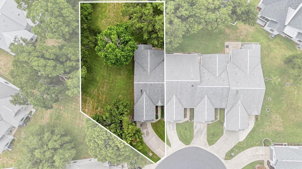 An aerial view shows a residential townhouse with a highlighted lot and driveway — 6716 E WAYBRIDGE COURT, INVERNESS, FL