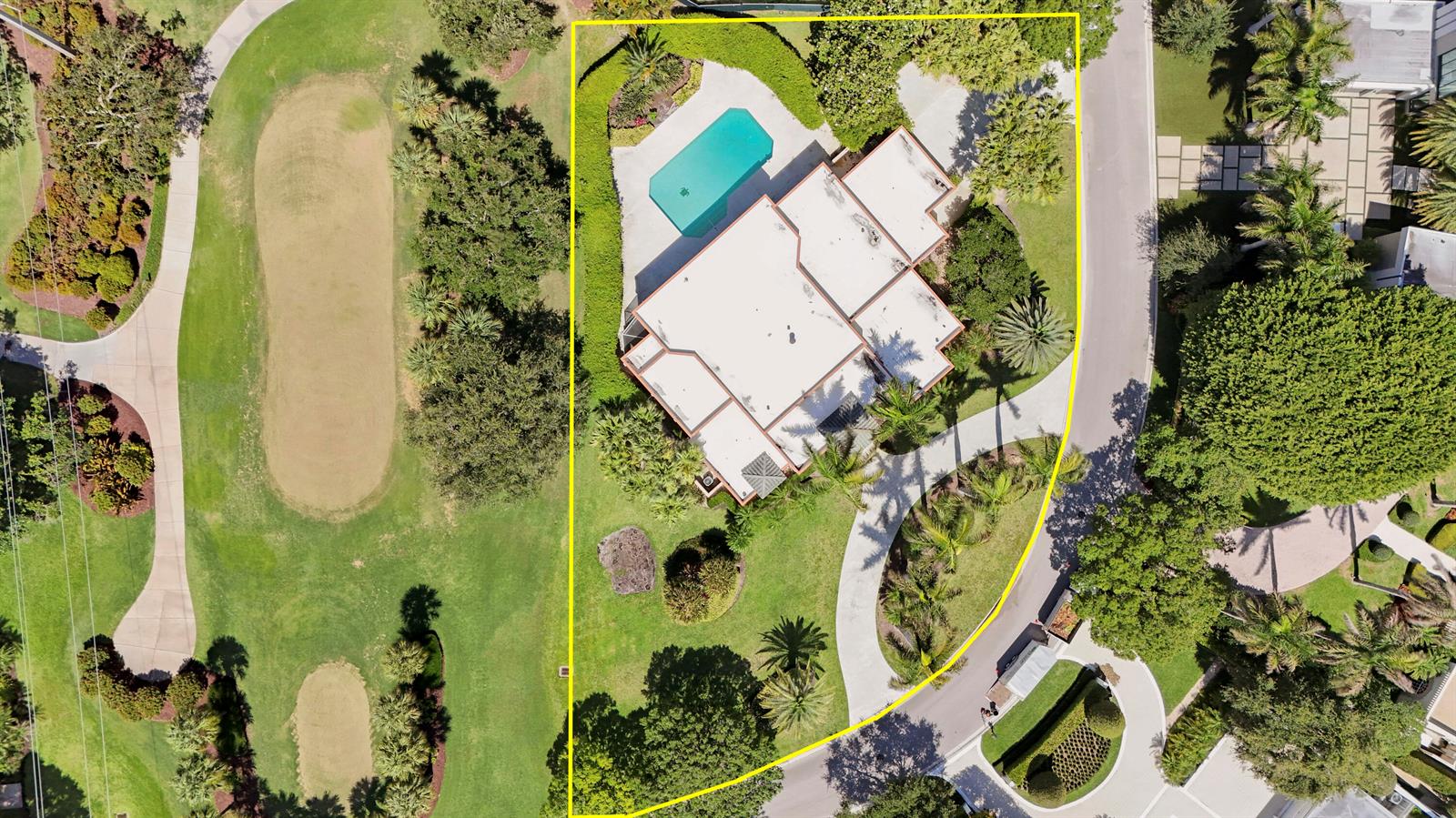 An aerial view shows a house with a swimming pool situated on a golf course — 171 Spyglass Lane, Jupiter FL 33477, JUPITER, FL