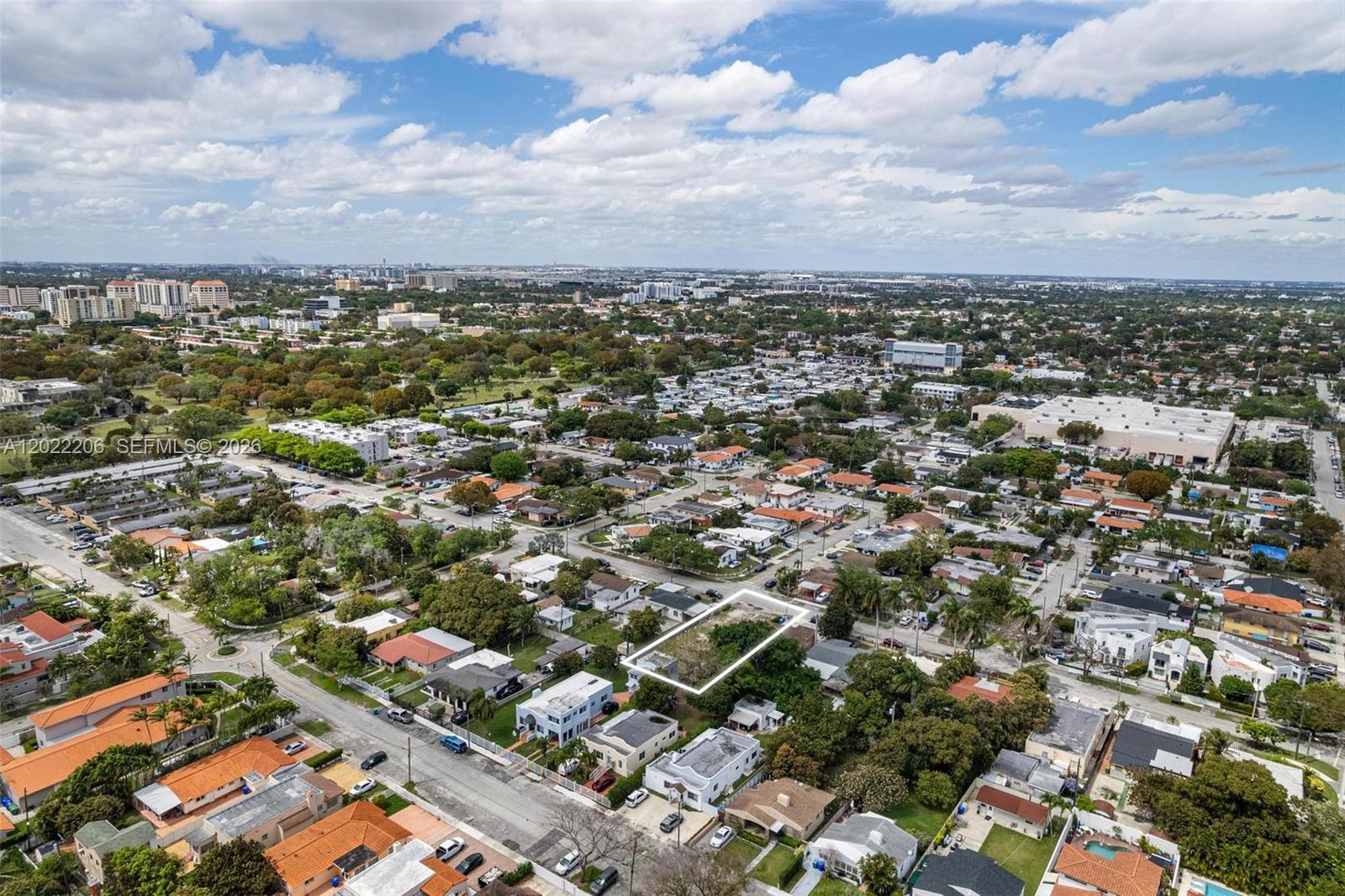 An aerial view shows a vacant, rectangular residential lot outlined in white within a suburban neighborhood — 3056 SW 13th St, Miami FL 33145, MIAMI, FL