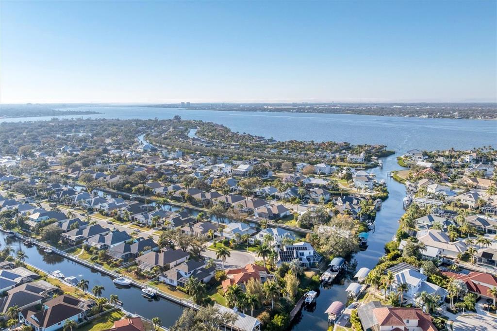 An aerial view of a residential neighborhood with houses situated along interconnected canals and waterways — 4627 BARRACUDA DRIVE, BRADENTON, FL