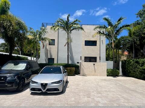 A modern two-story house with a paved driveway, palm trees, and two parked cars — 1955 NE 4th Street Unit 2, Deerfield Beach FL 33441, DEERFIELD BEACH, FL