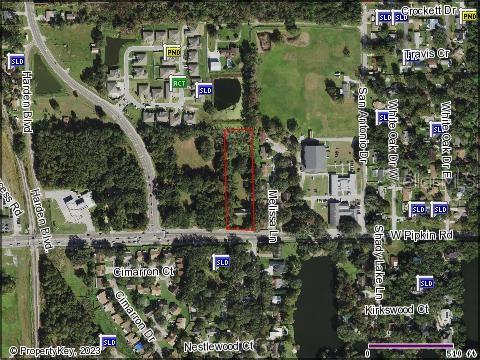 This is an aerial map showing a rectangular property parcel outlined in red near roads — 809 W PIPKIN ROAD, LAKELAND, FL