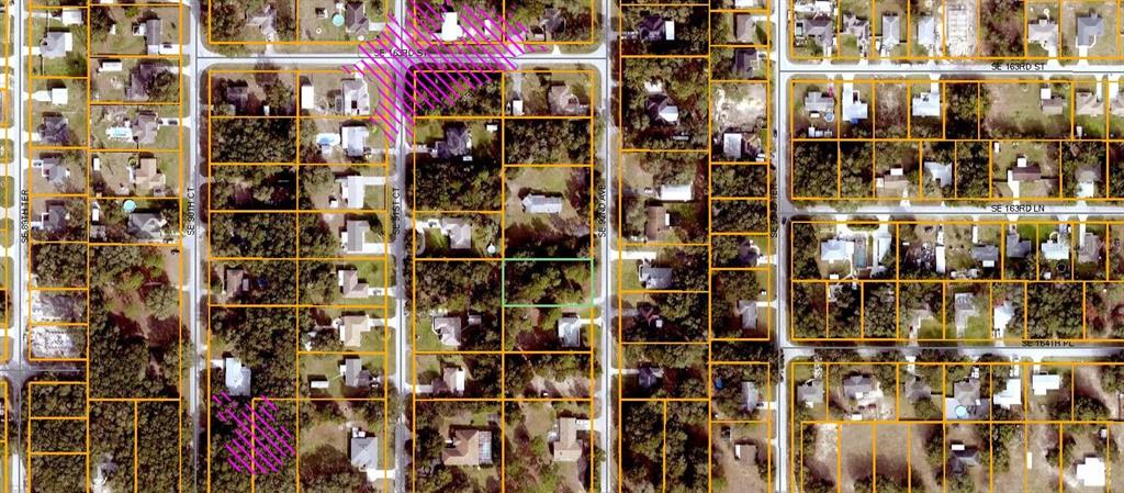 This is an aerial map showing residential lots and streets in a suburban neighborhood — SE 92ND AVENUE, SUMMERFIELD, FL