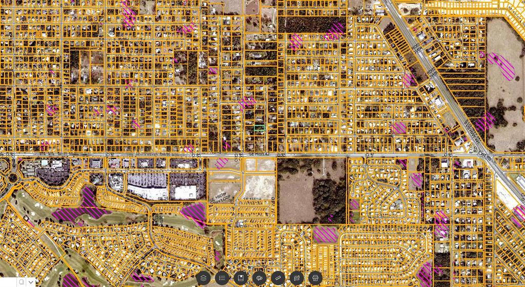 This is an aerial map showing property parcel boundaries and road layouts in a residential area — SE 92ND AVENUE, SUMMERFIELD, FL