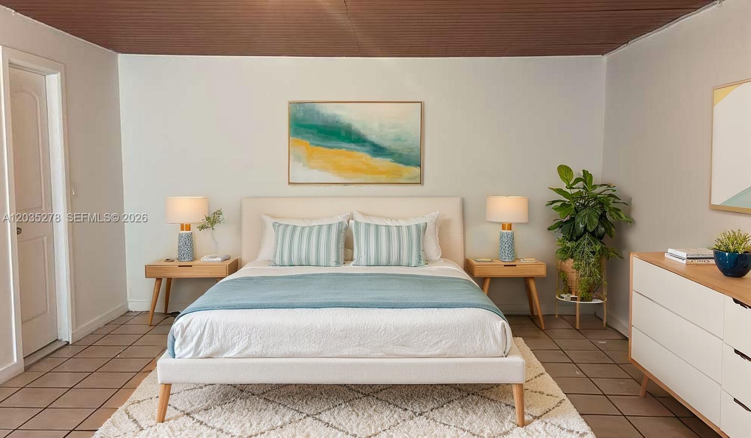 A bedroom features a bed with a blue throw, two nightstands, and a tiled floor — 5950 NW 114th St- Efficiency 1,, Hialeah FL 33012, HIALEAH, FL