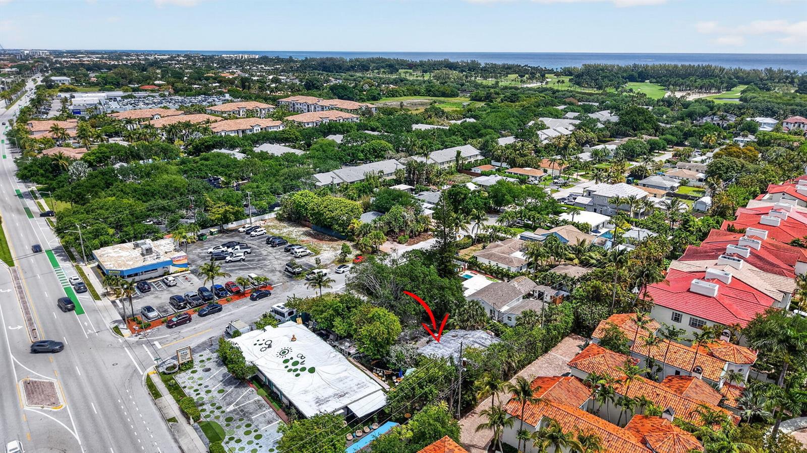 An aerial view shows a residential property with a red arrow pointing to its roof — 600 Allen Avenue, Delray Beach FL 33483, DELRAY BEACH, FL