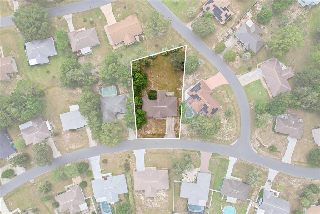 This is an aerial view of a residential property with a house and yard — 3454 N HONEYLOCUST DRIVE, BEVERLY HILLS, FL