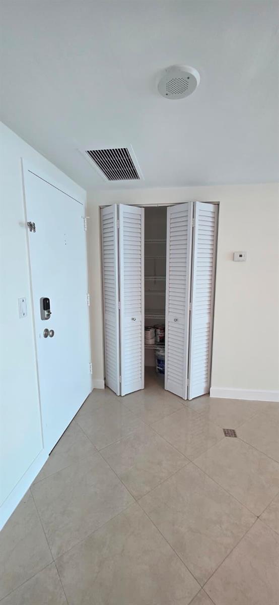 Aerial view of a waterfront residential complex featuring three high-rise towers and a swimming pool — 11111 Biscayne Boulevard # 4c, Miami FL 33181, MIAMI, FL