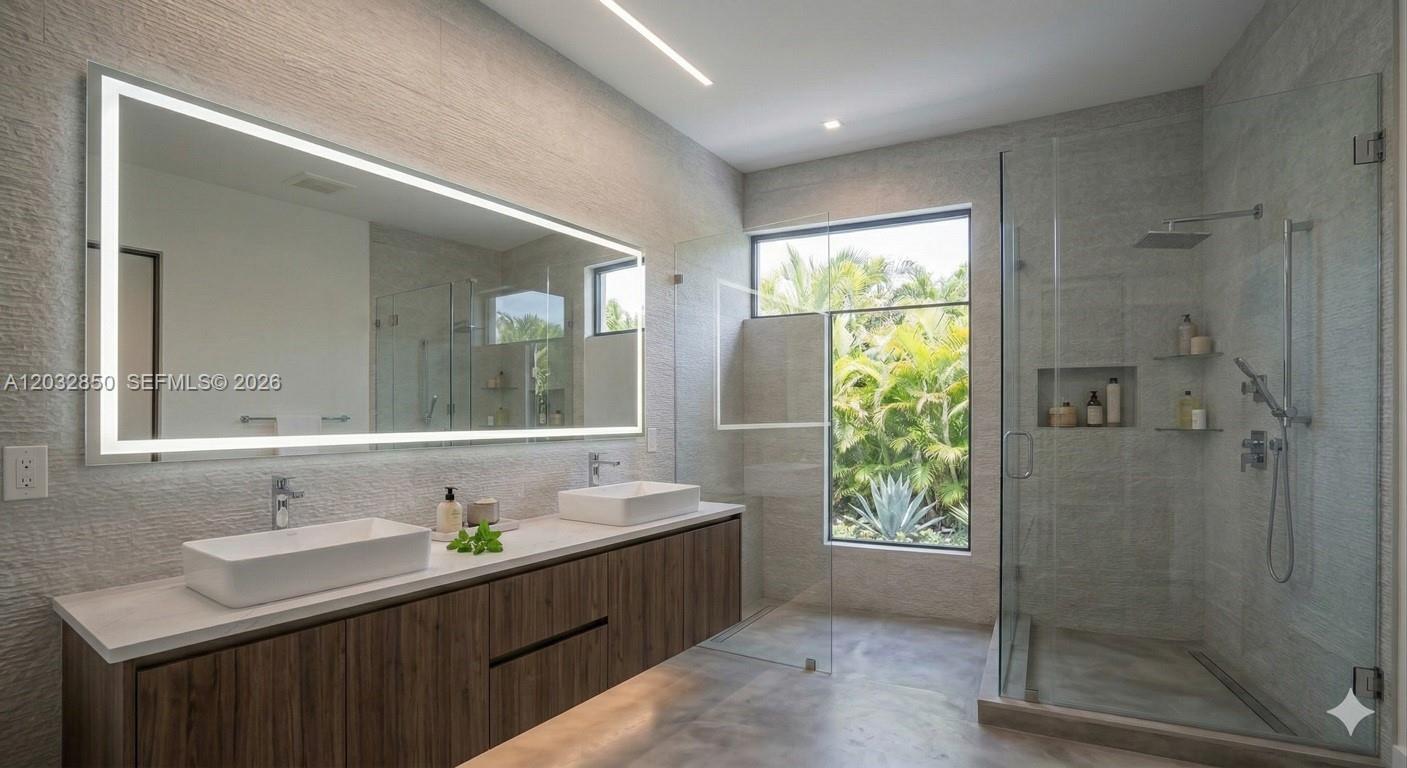A modern bathroom features a double vanity, a large LED mirror, and a glass-enclosed shower — 5650 N Miami Ave, Miami FL 33127, MIAMI, FL