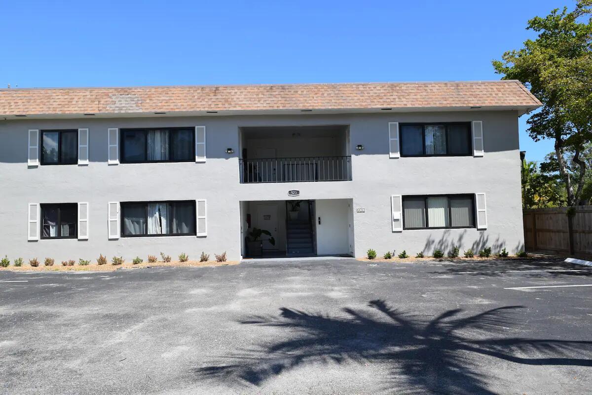 A two-story apartment building with a grey stucco exterior and a paved parking lot — 523 SE 20th Court # 5, Boynton Beach FL 33435, BOYNTON BEACH, FL