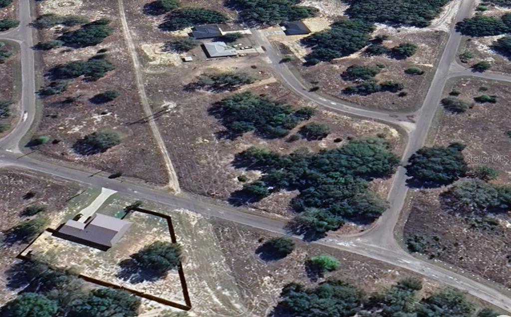 This is an aerial map view of a vacant residential lot with trees — Lot 1 GUAVA TERRACE, OCKLAWAHA, FL