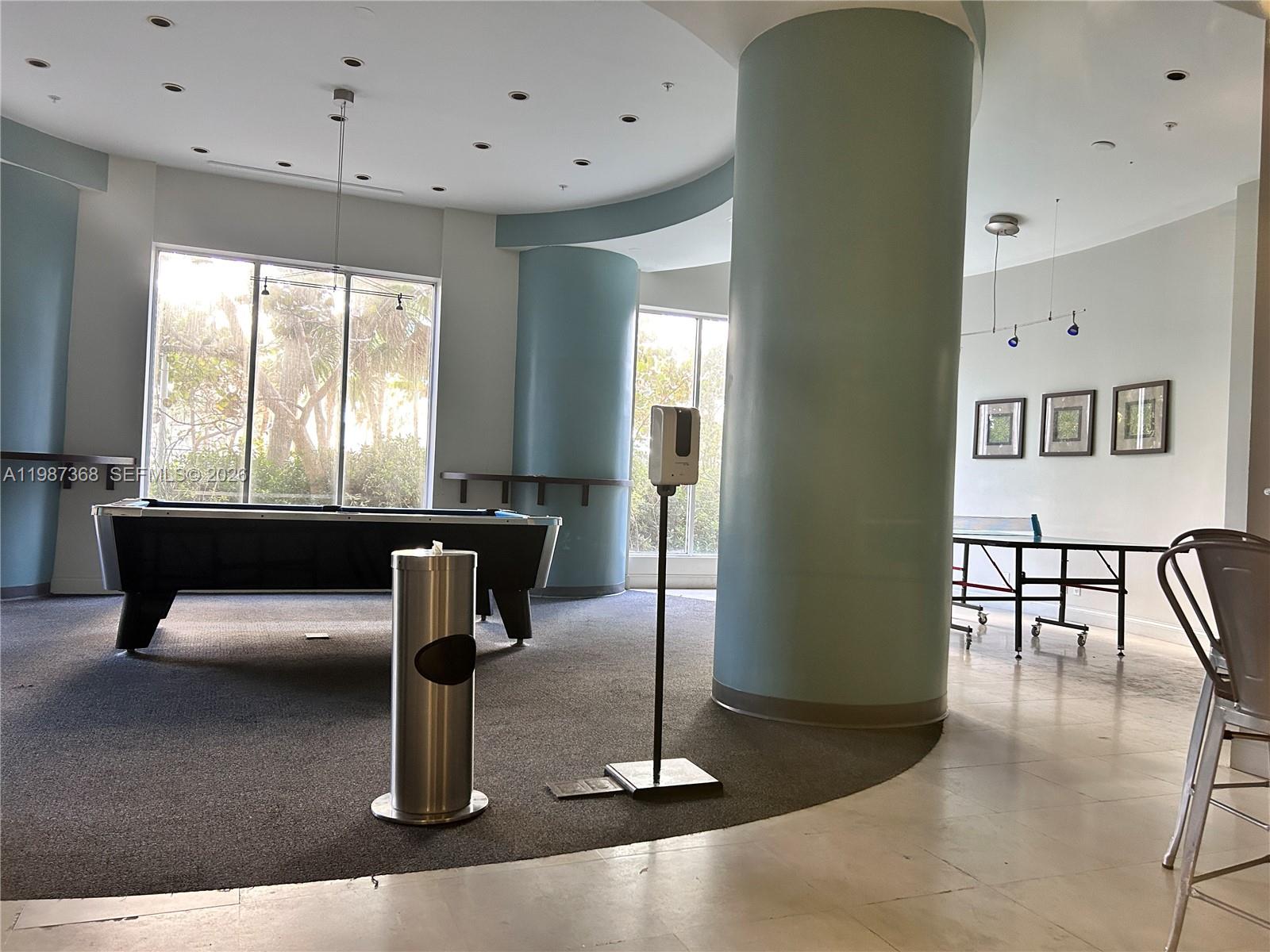 A game room features a pool table, a ping pong table, and a large pillar — 4001 S Ocean Dr # 4G, Hollywood FL 33019, HOLLYWOOD, FL