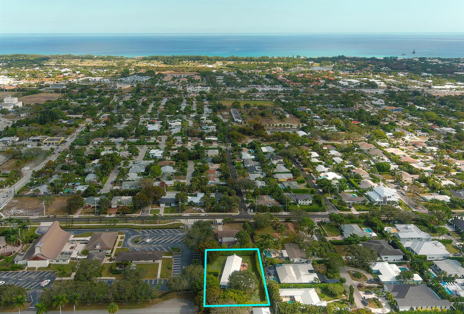 An aerial view shows a residential property highlighted in blue within a suburban coastal neighborhood — 2001 NW 1st Avenue, Delray Beach FL 33444, DELRAY BEACH, FL