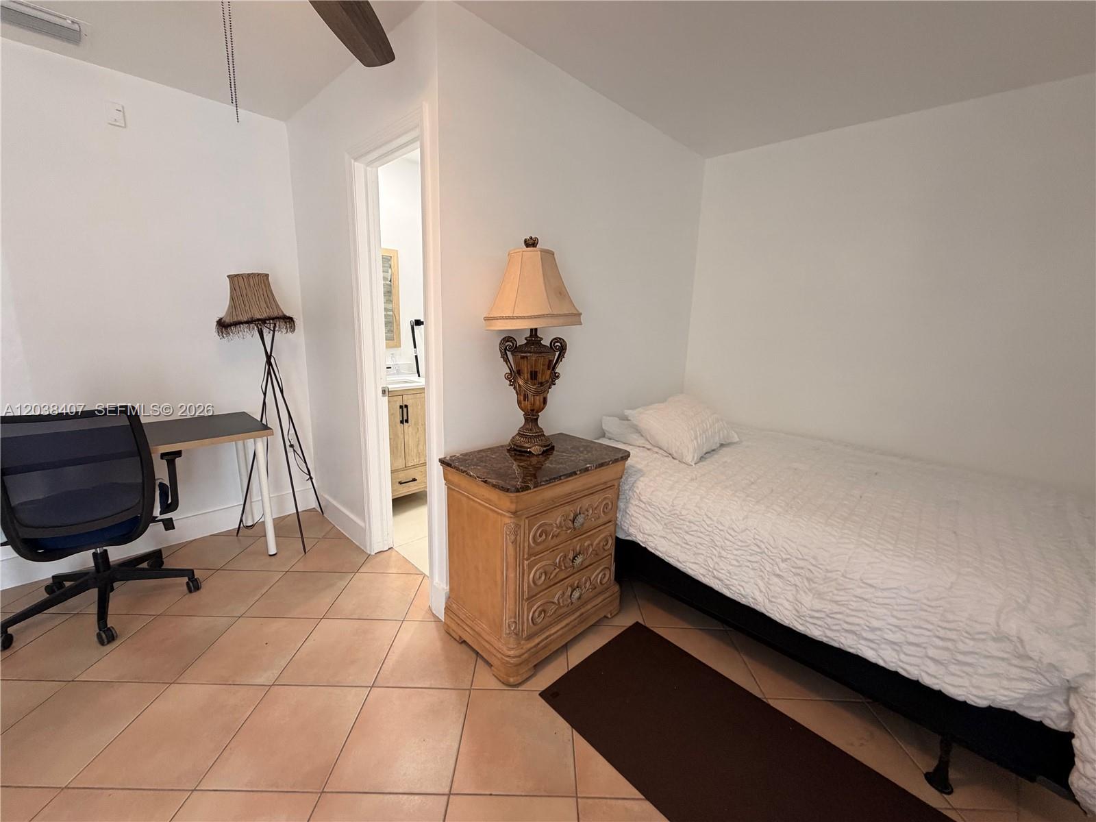 A bedroom features tile flooring, a single bed, a nightstand, and a desk — 5931 SW 148th Pl # 1, Miami FL 33193, MIAMI, FL