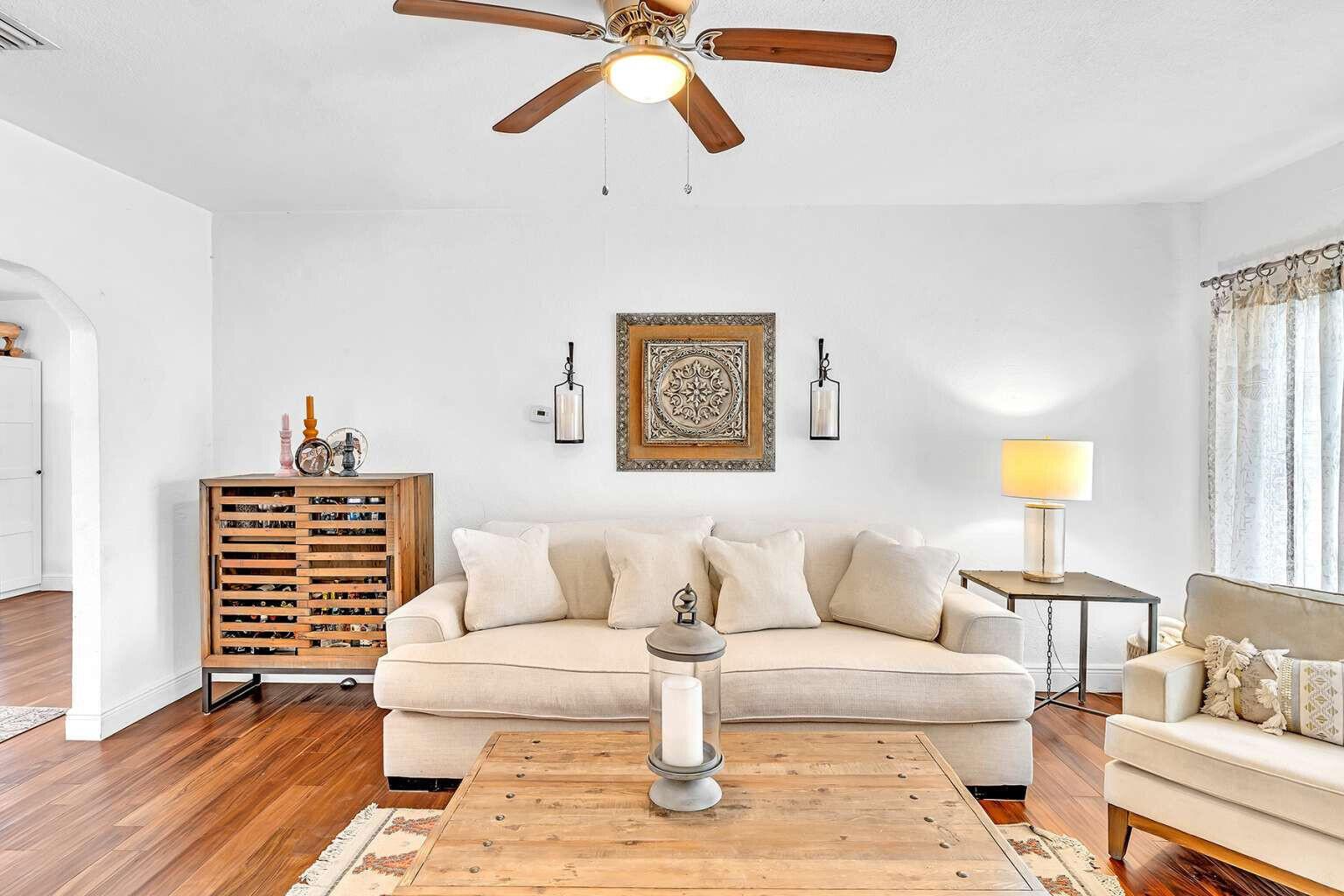 A living room features a beige sofa, wooden coffee table, and a ceiling fan — 784 NE 81st Street, Miami FL 33138, MIAMI, FL