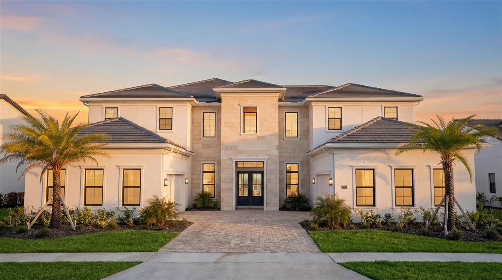A two-story house with a stone facade, dark-framed windows, and two palm trees in front — 9760 LAUREL BERRY DRIVE, ORLANDO, FL