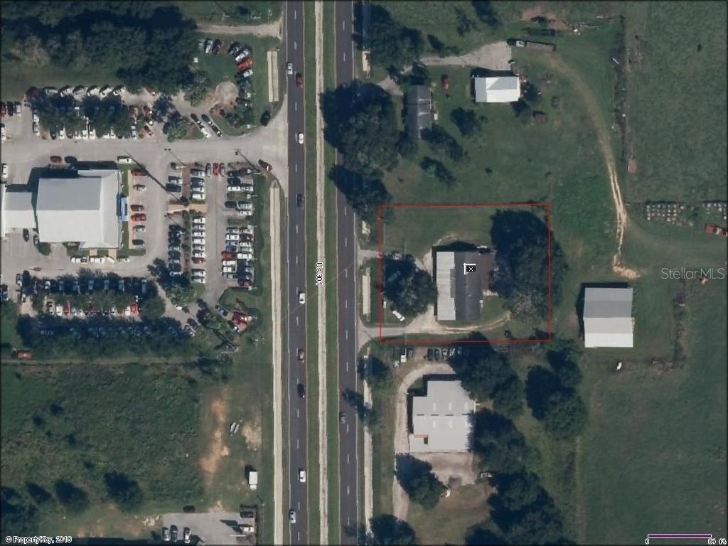 This aerial map shows a residential property outlined in red along a divided highway — 10736 US HIGHWAY 301, DADE CITY, FL