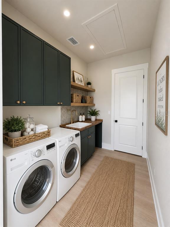 A laundry room features dark green cabinets, a wood countertop, a sink, and white appliances — 8308 GIBSON OAKS DRIVE, LAKELAND, FL